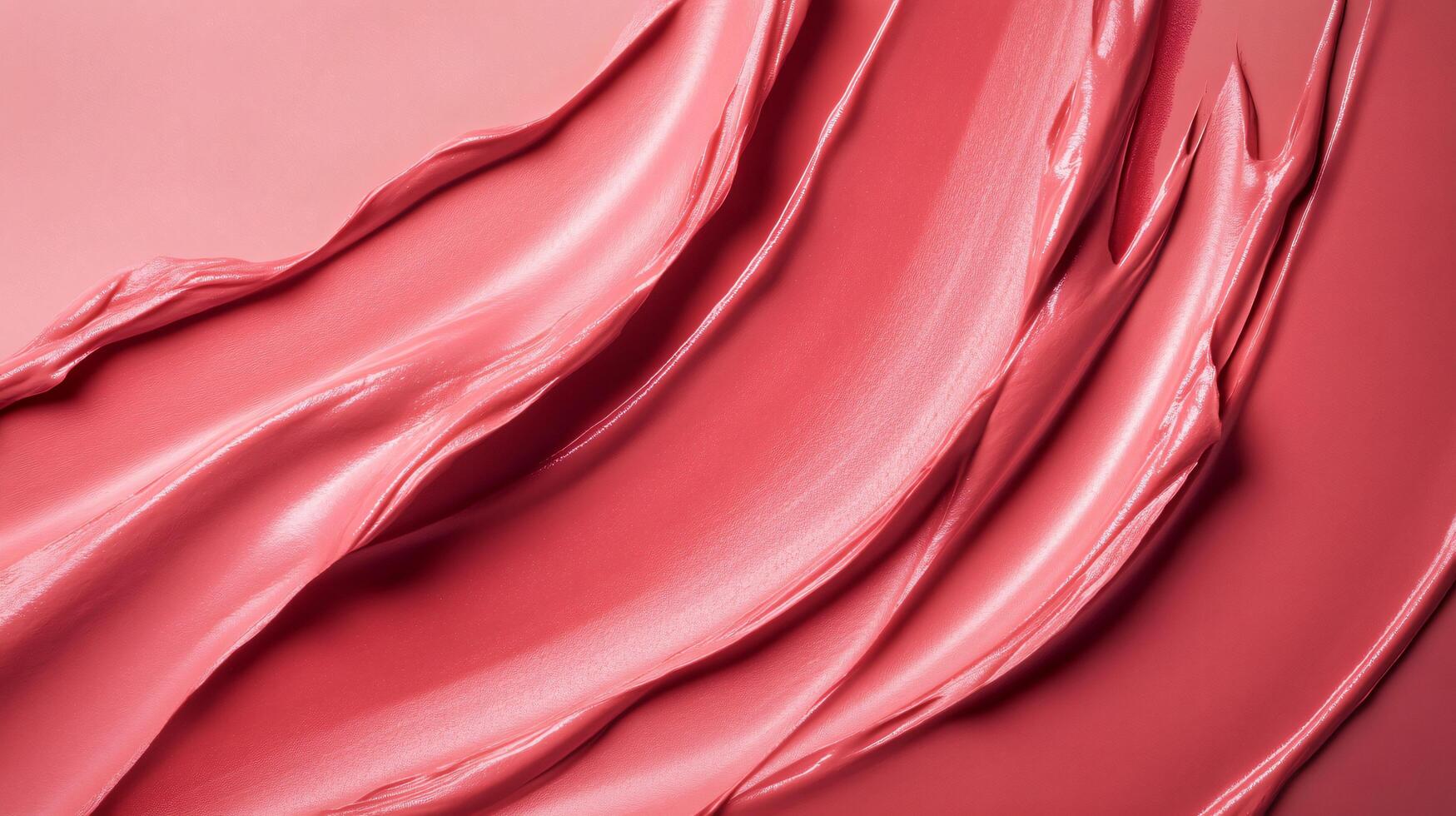 Close up of a pink lip gloss with a shiny, smooth texture. The lip gloss is applied in a way that creates a sense of movement and flow, giving the impression of a soft, natural look photo