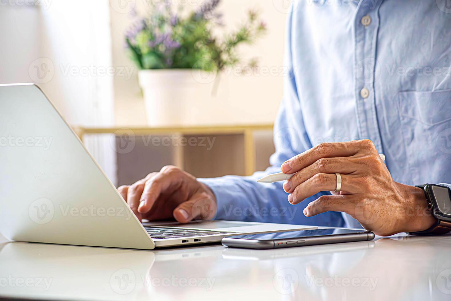 Confident businesswoman, financial advisor sitting typing report and point to income data Company earnings from information documents piled up on the desk on laptop computer screen in office. photo