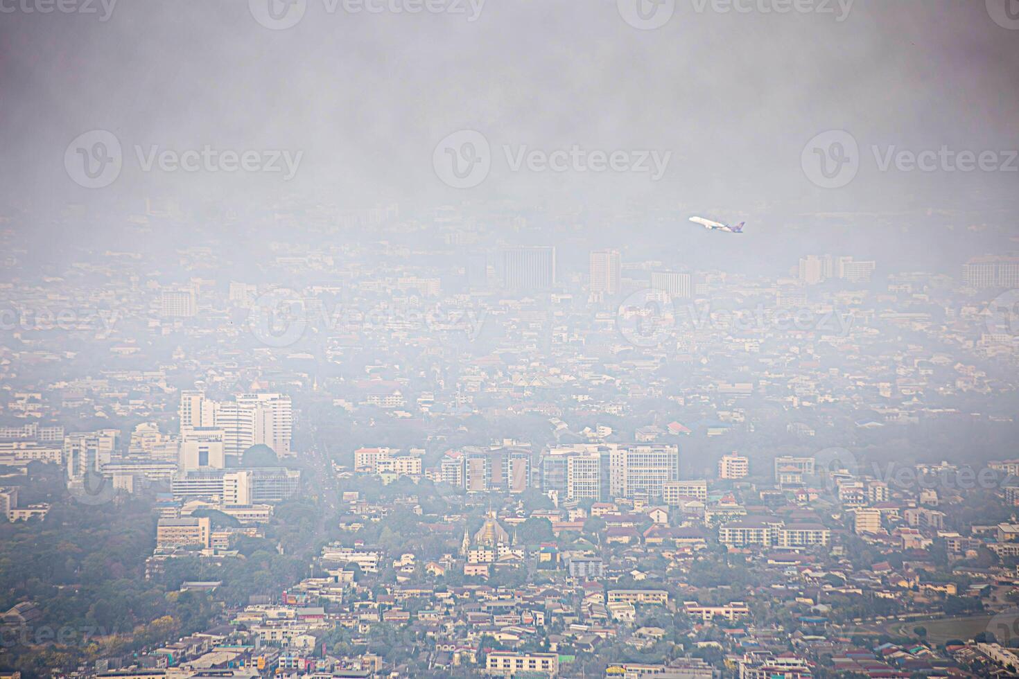 Fog or haze combined with smoke and other atmospheric pollutants in the city from PM 2.5 dust. Cityscape with word of PM 2.5 and air pollution. PM 2.5 concept. photo