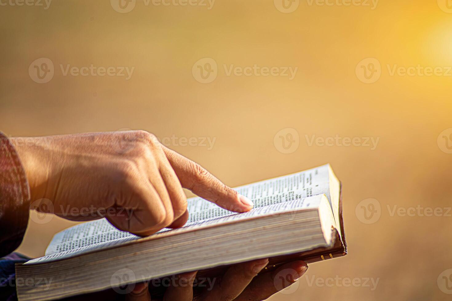 Man reading from the holy bible in the Morning with copy space,close up, photo