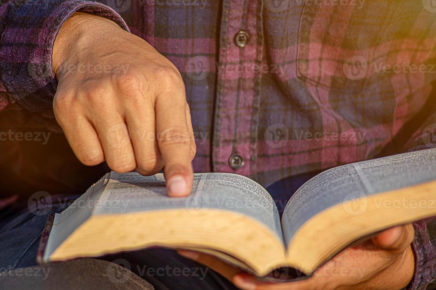 Man reading from the holy bible in the Morning with copy space,close up, photo