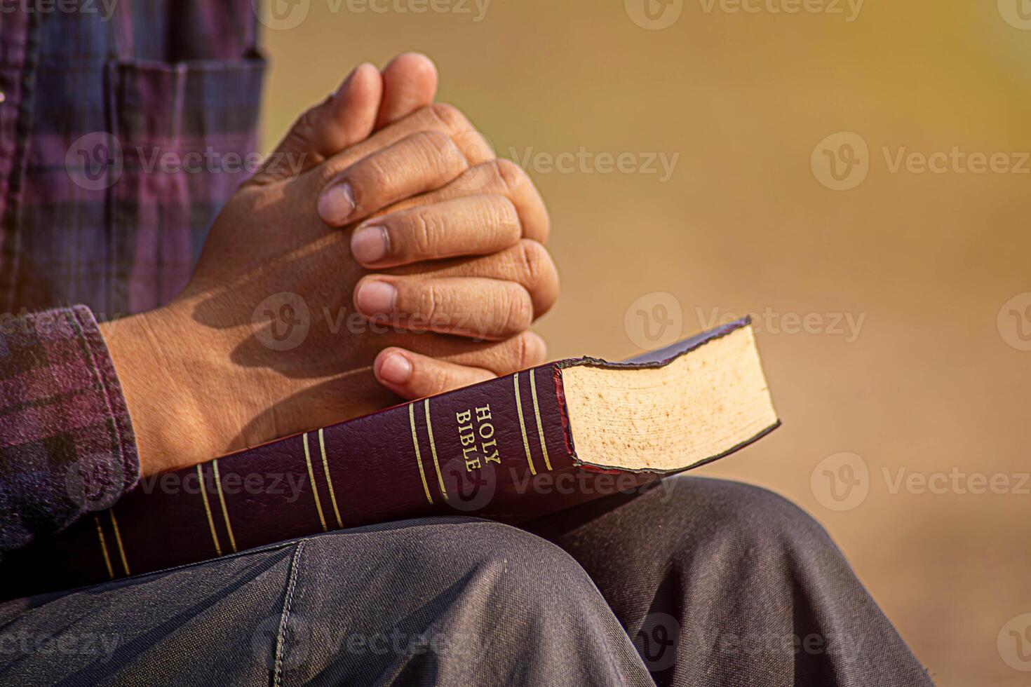 Silhouette of woman kneeling down praying for worship God at sky background photo