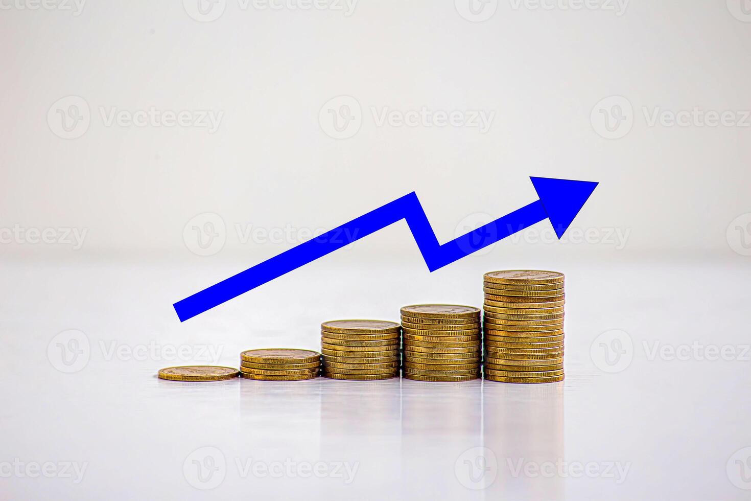 stack of silver coins with trading chart in financial concepts and financial investment business stock growth photo