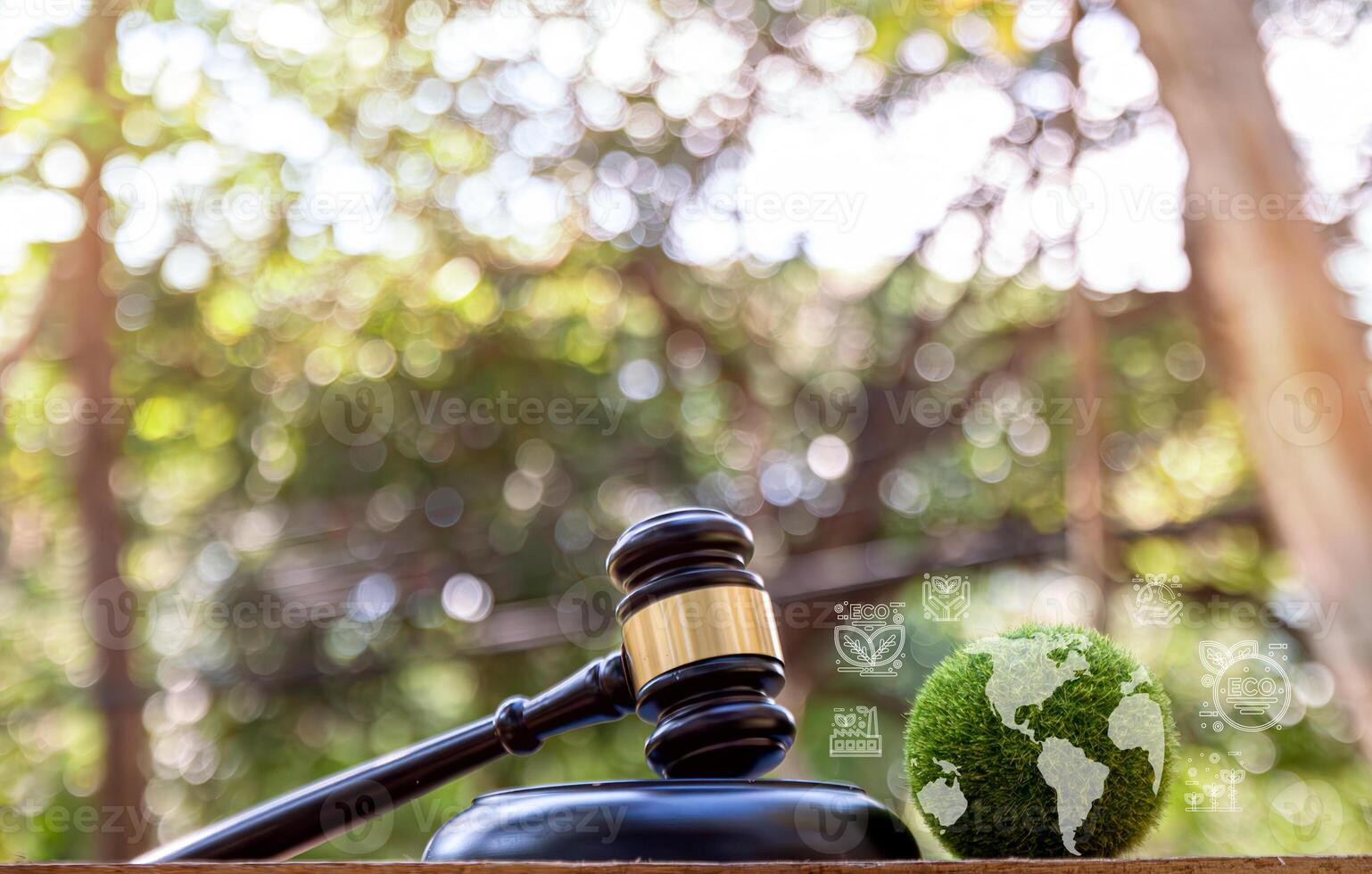 Green World and gavel with scales of justice on a green background. photo
