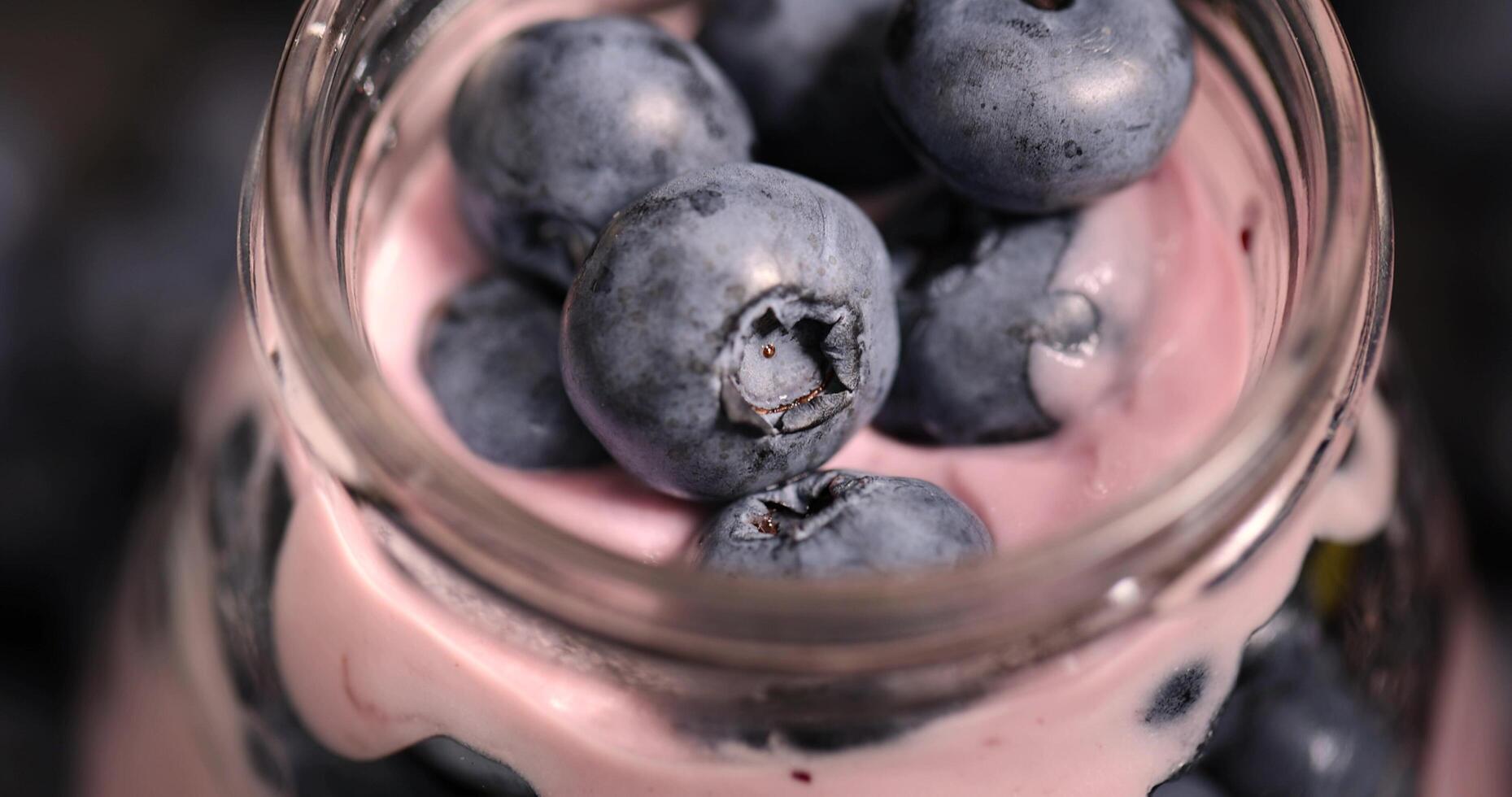 fresh cold yogurt with the taste and berries of ripe blueberries photo