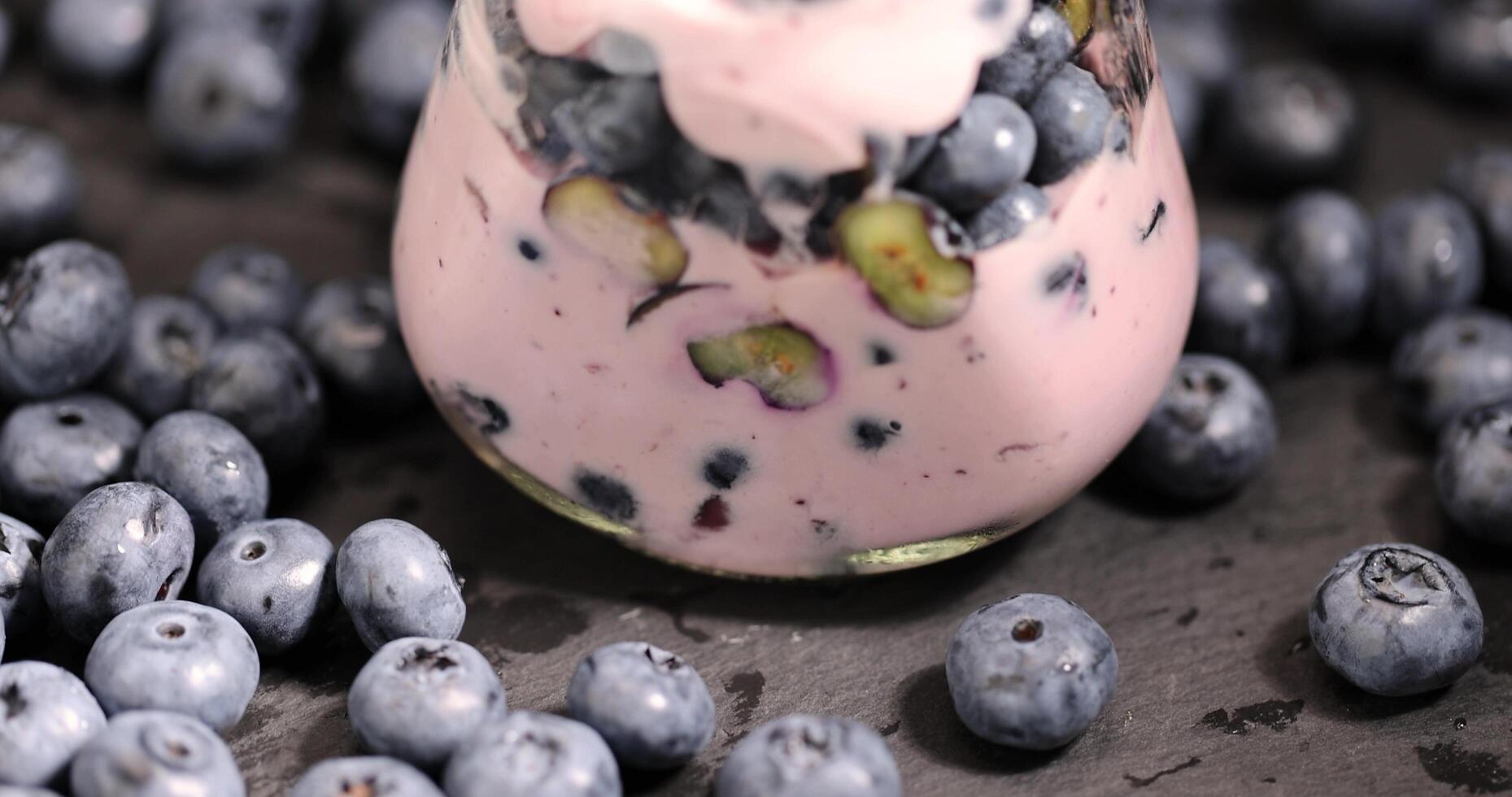 fresh cold yogurt with the taste and berries of ripe blueberries photo