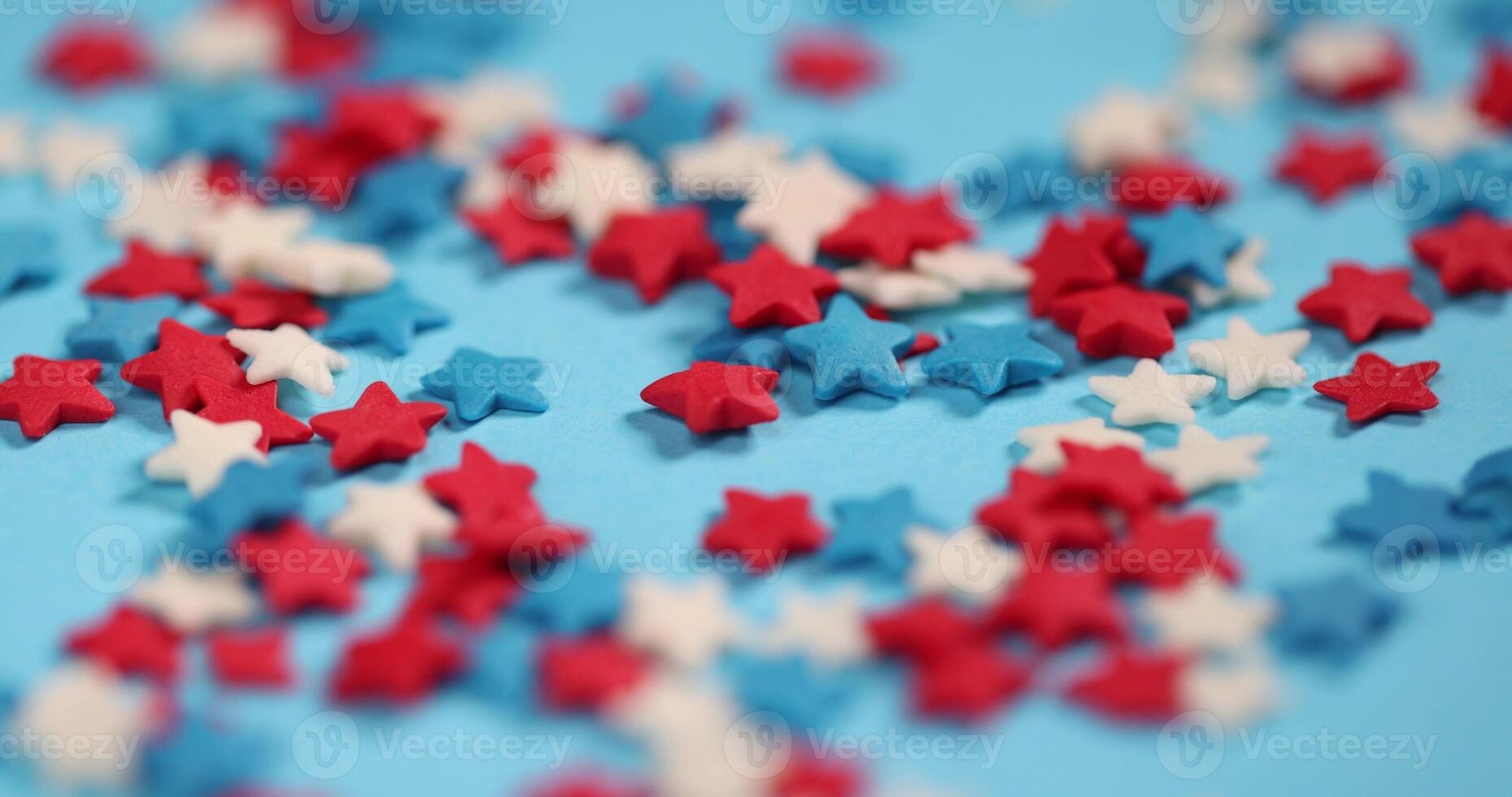 white red and blue stars on blue paper photo