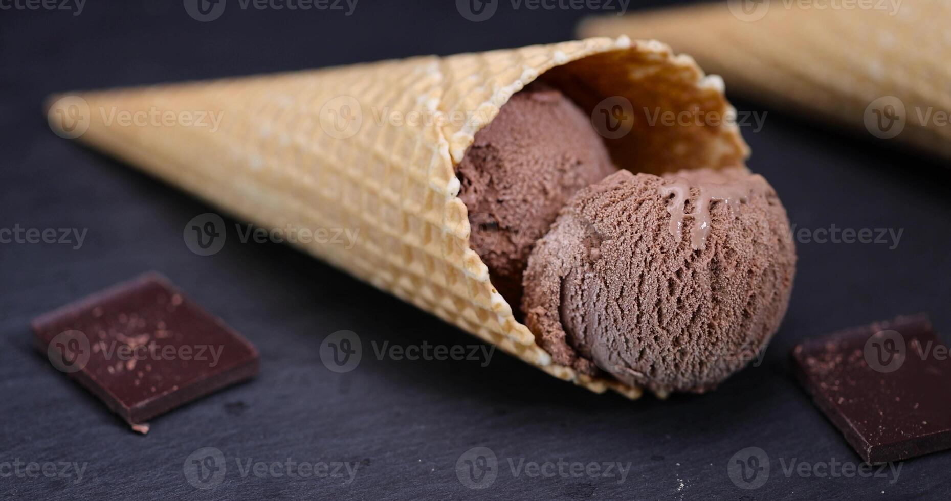 waffle cone with chocolate ice cream with cocoa photo