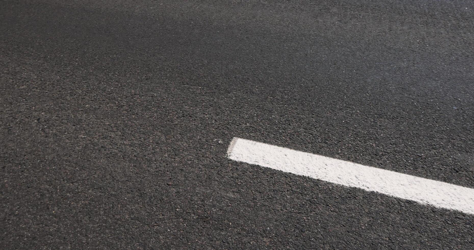 details of road markings on the road for traffic control photo