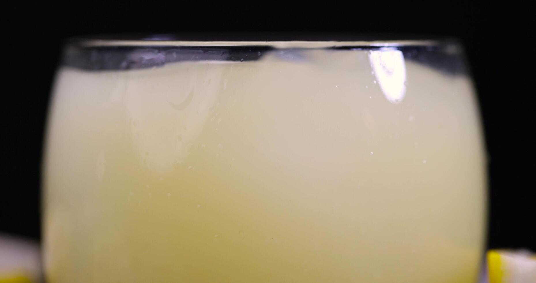 ripe sliced lemon and lemon juice with ice photo