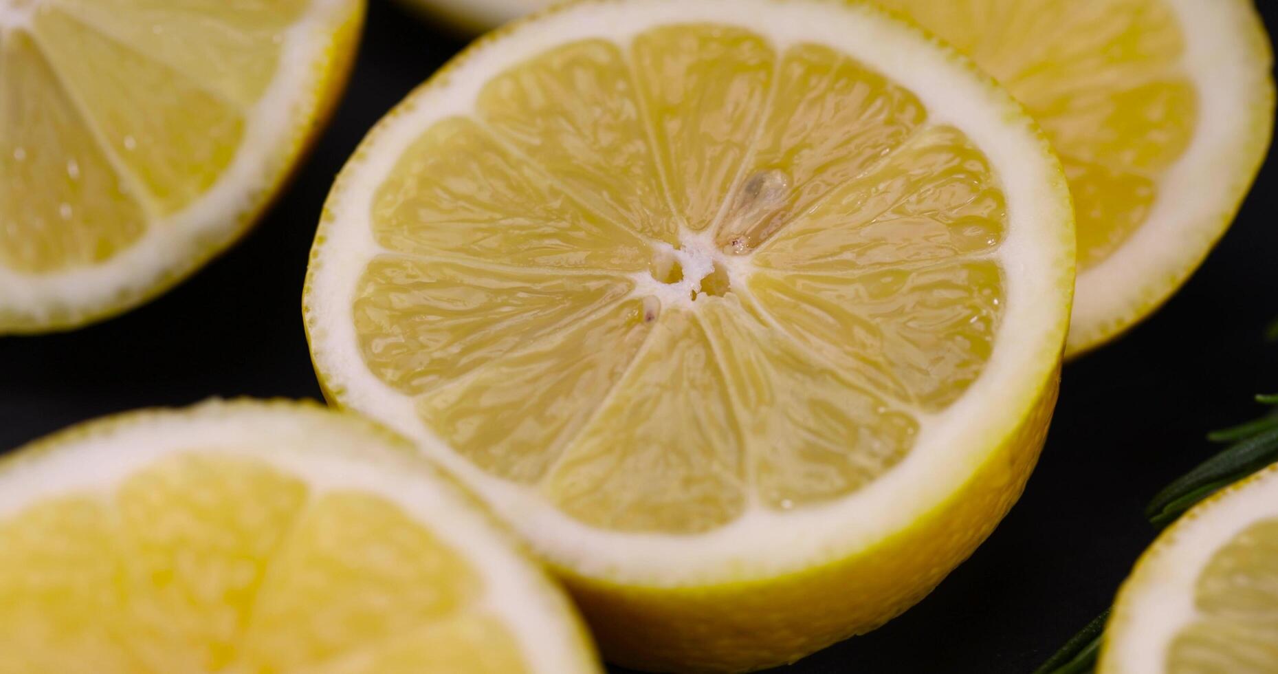 slices of sour lemon on a black board photo