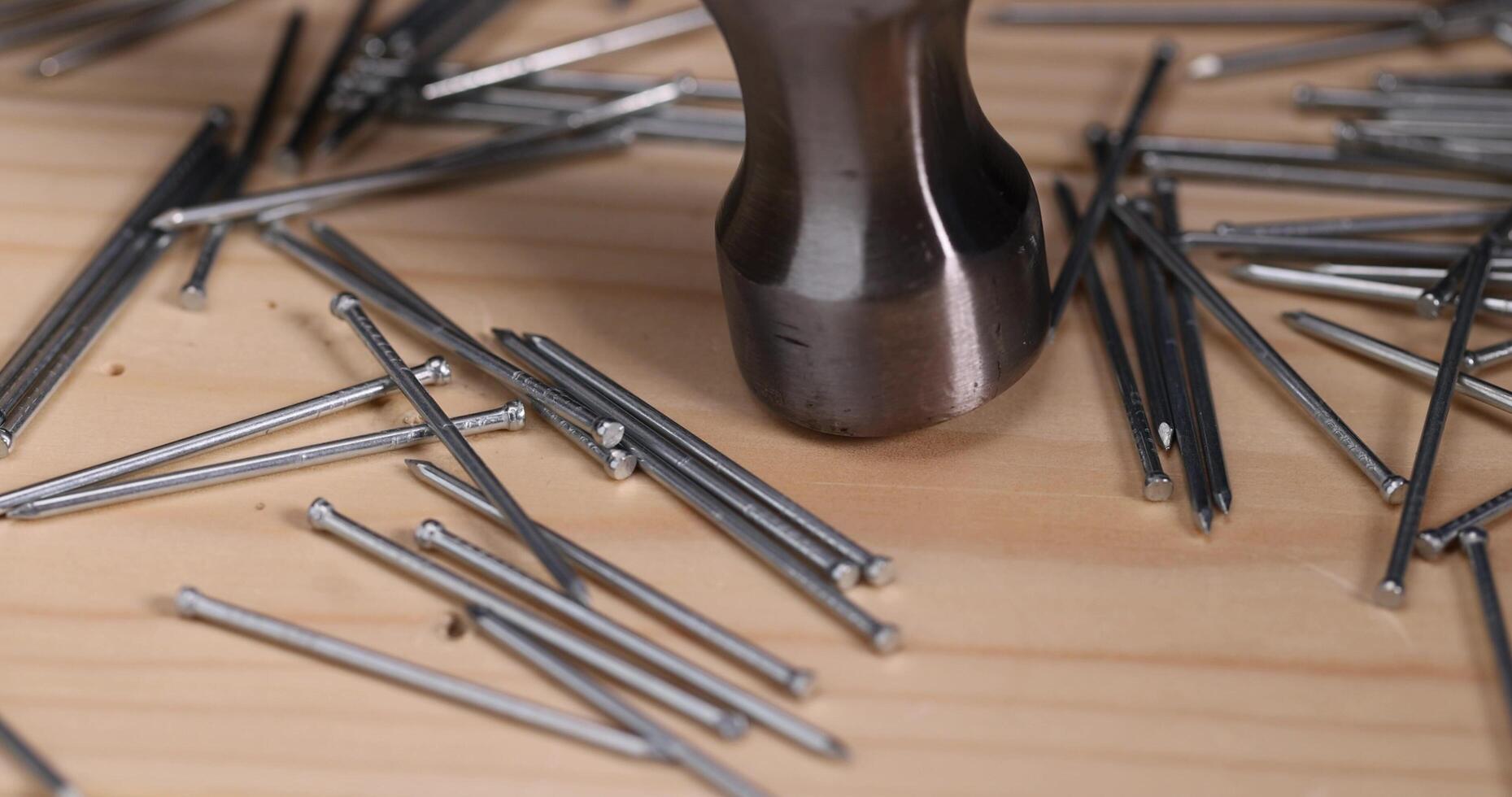 hammer and small galvanized nails for decorative work photo