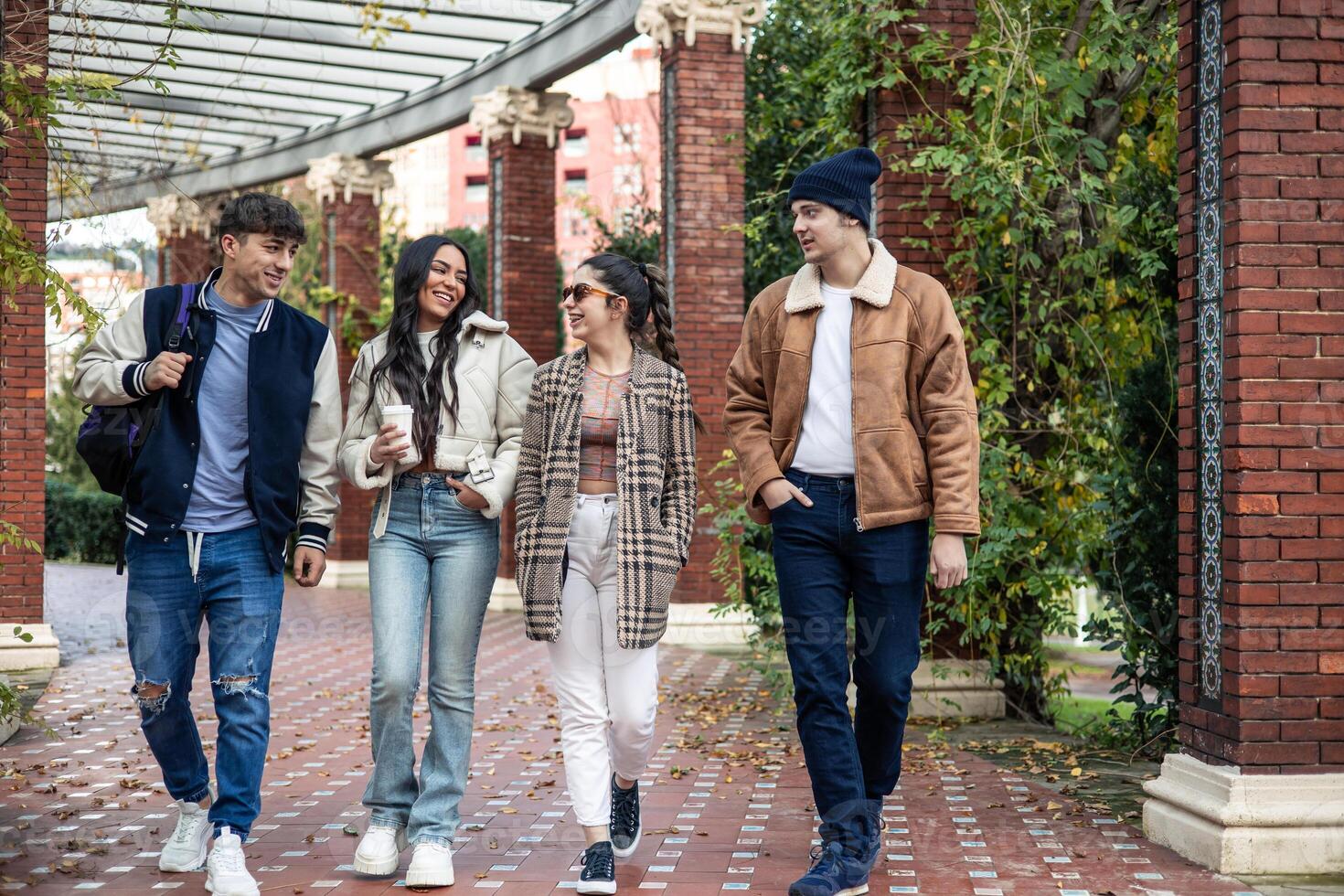 group of four young students enjoying after class photo
