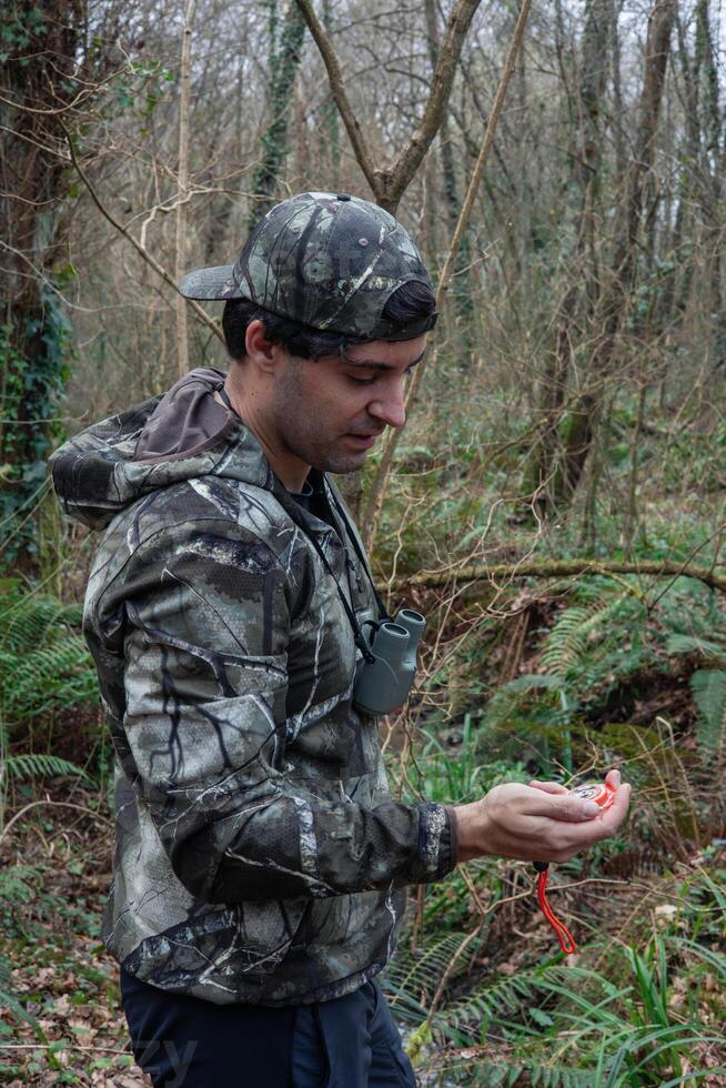 vertical portrait Comepass-Guided Expdition Navigating the Forest's Depths photo