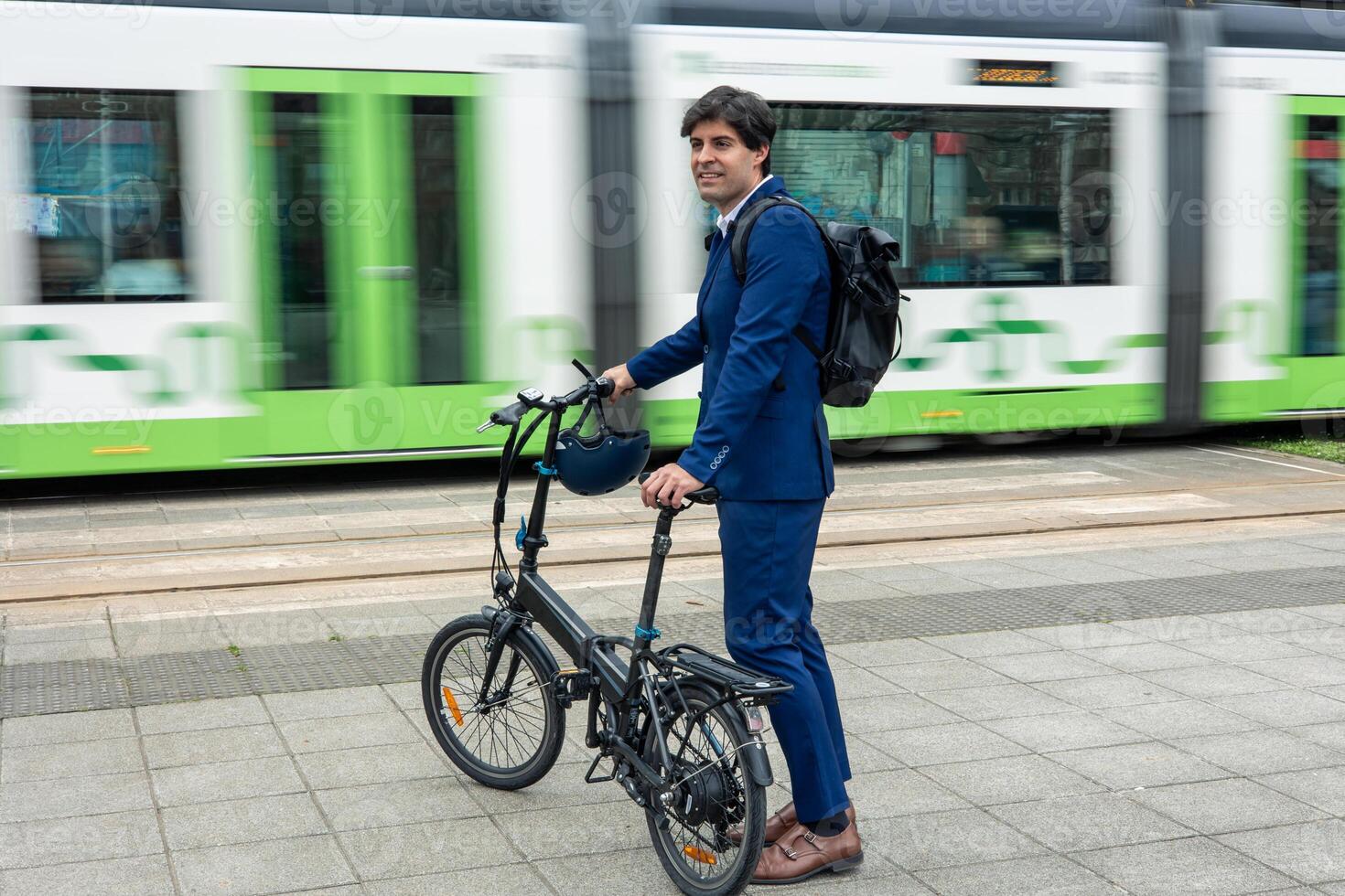 Urban Commuter with Electric Bike and Tram in Motion photo