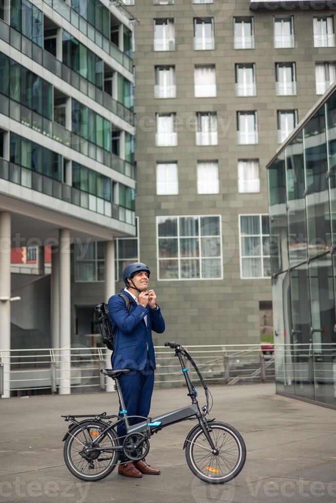 vertical portrait Urban Commute Businessman Preparing for Sustainable Journey photo
