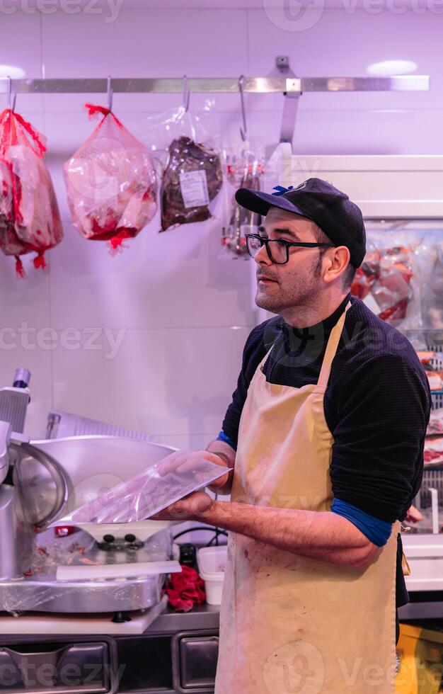 vertical portrait Caring Craft Butcher Packaging Freshly Cut Meat photo