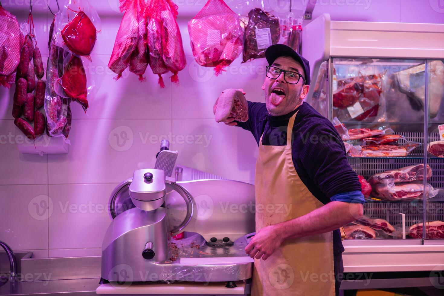 The Playful Butcher A Lighthearted Moment in the Butcher Shop photo