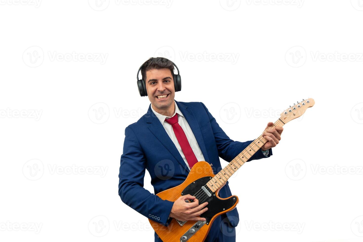 Businessman Wearing Headphones Playing Electric Guitar and Smiling at Camera white background photo