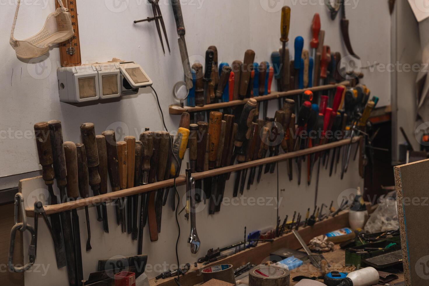 Carpentry Workshop Various Tools Hanging on Wall photo