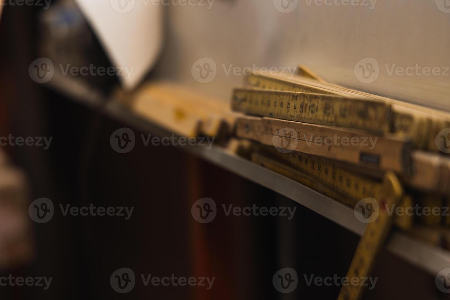Closeup of Vintage Professional Measuring Tape in Carpentry Workshop photo