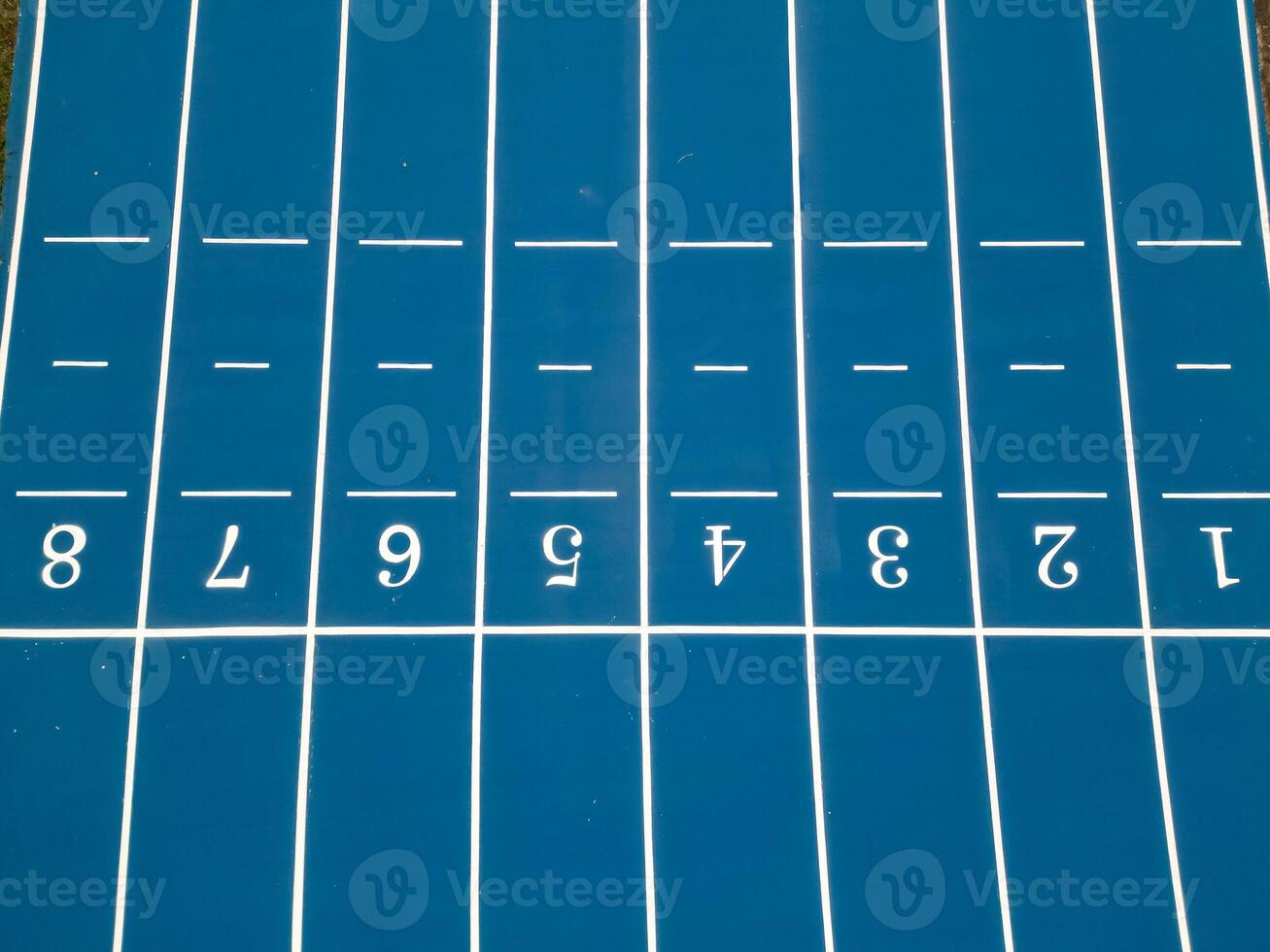Aerial Drone View of Blue Athletic Track Start Line photo