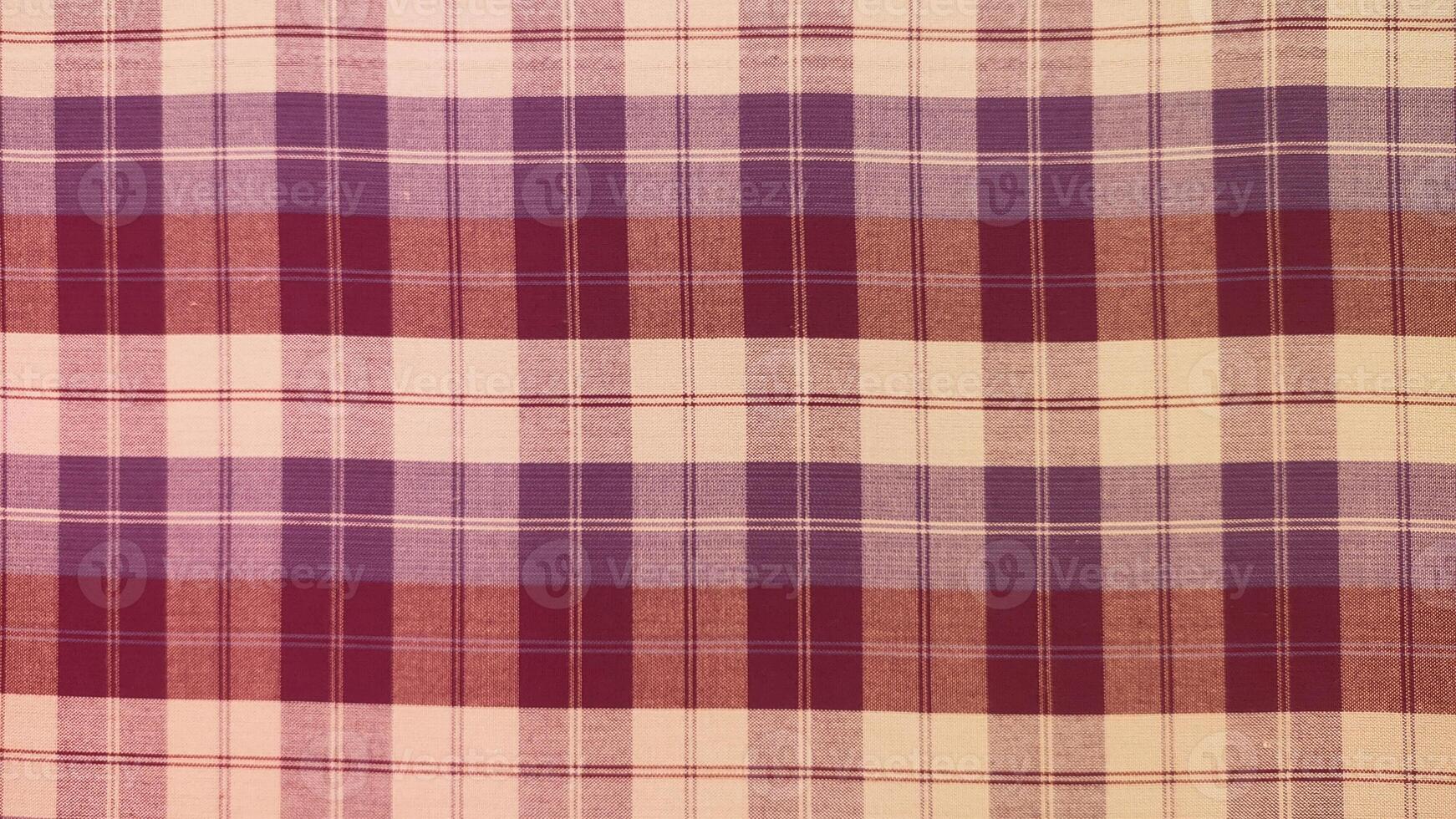 A checkered cloth with a purple and white pattern photo