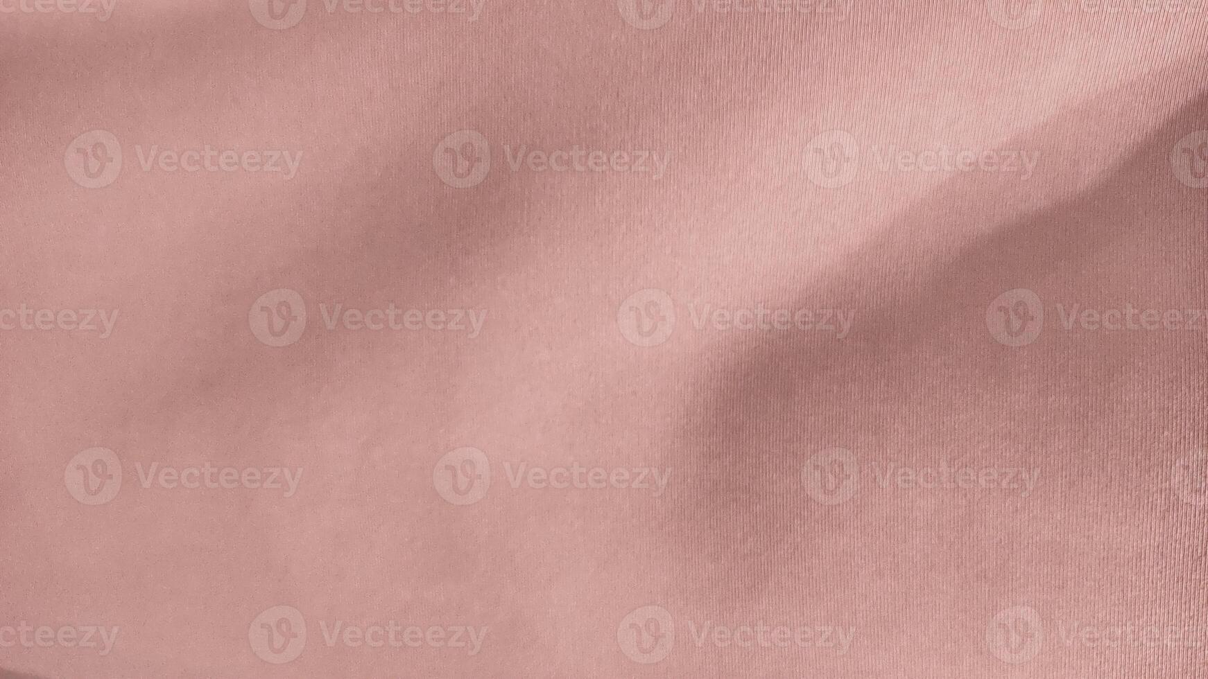 A pink fabric with a striped pattern photo