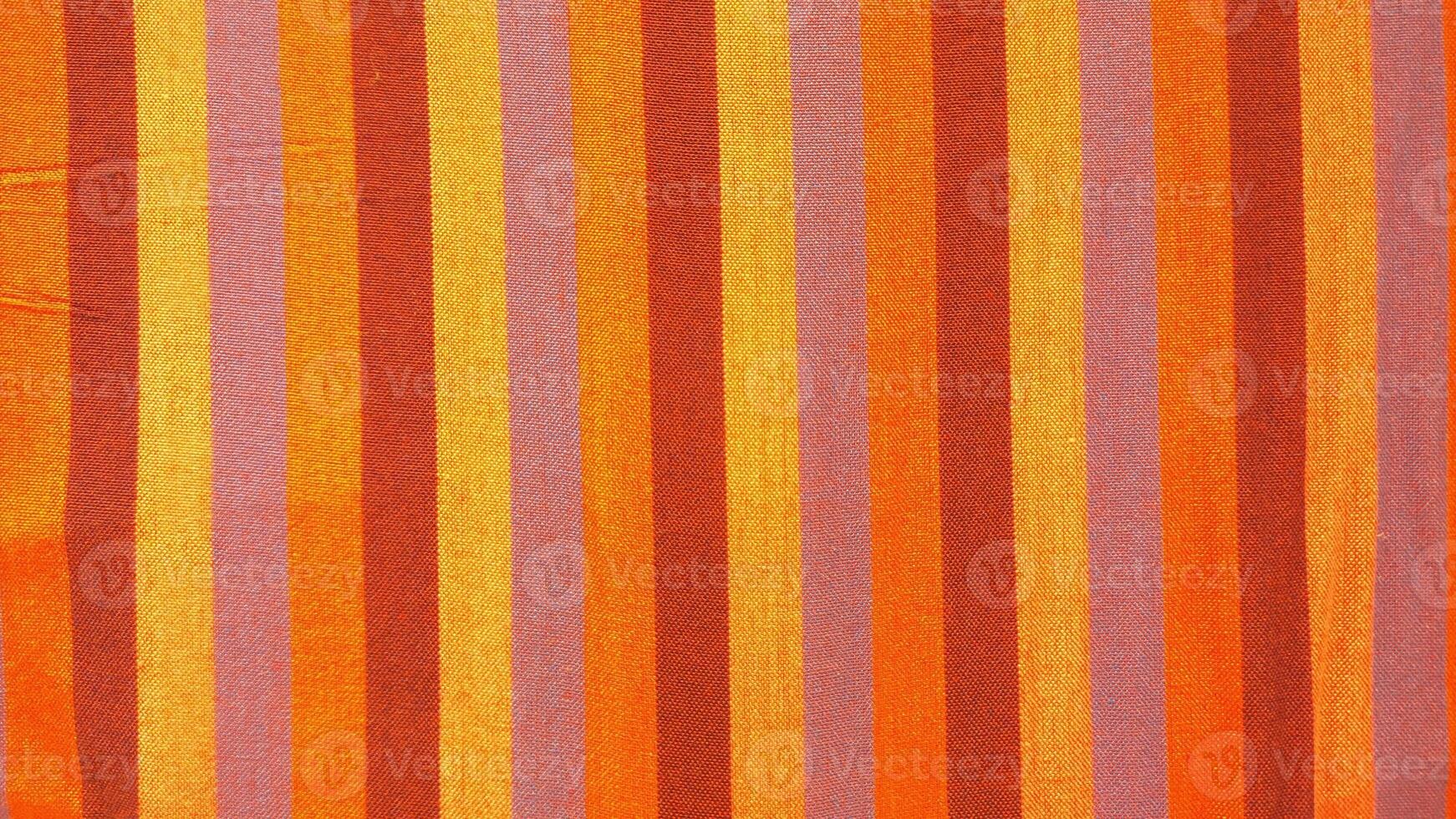 A striped orange and pink fabric photo