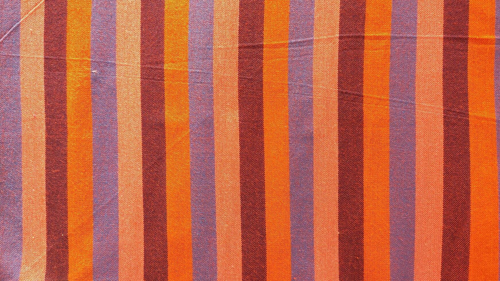 A striped orange and purple fabric photo