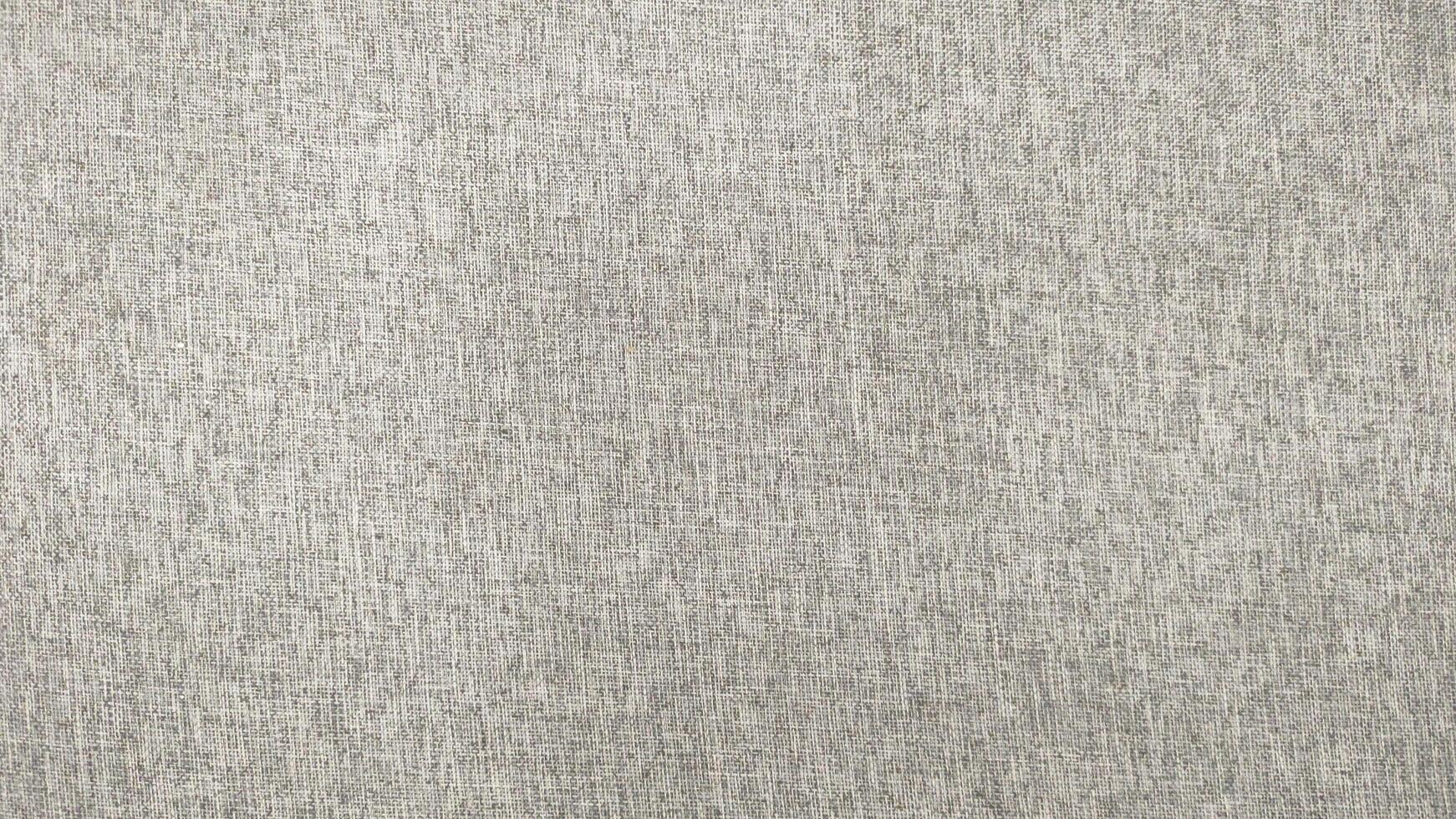 A white fabric with a pattern of small squares photo
