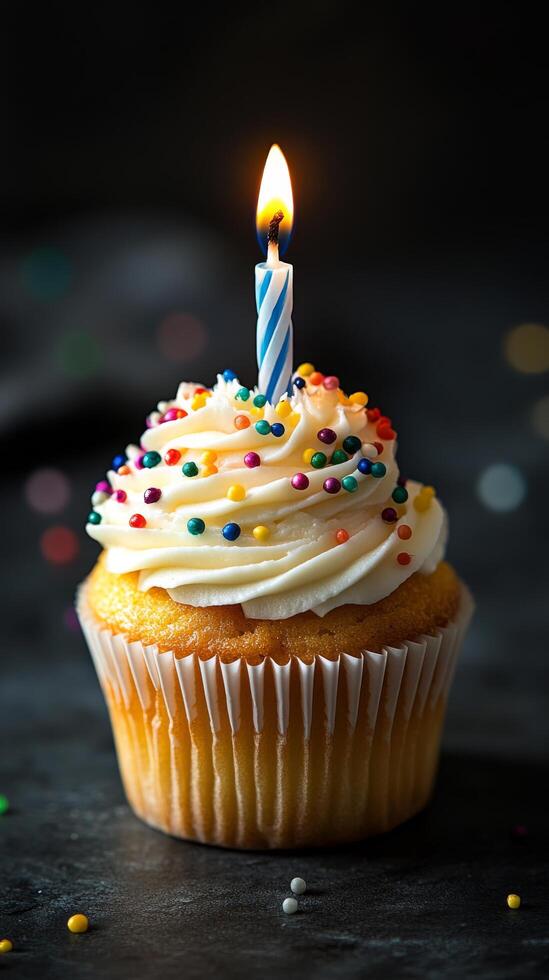 Celebratory cupcake with candle and colorful sprinkles for a special occasion photo