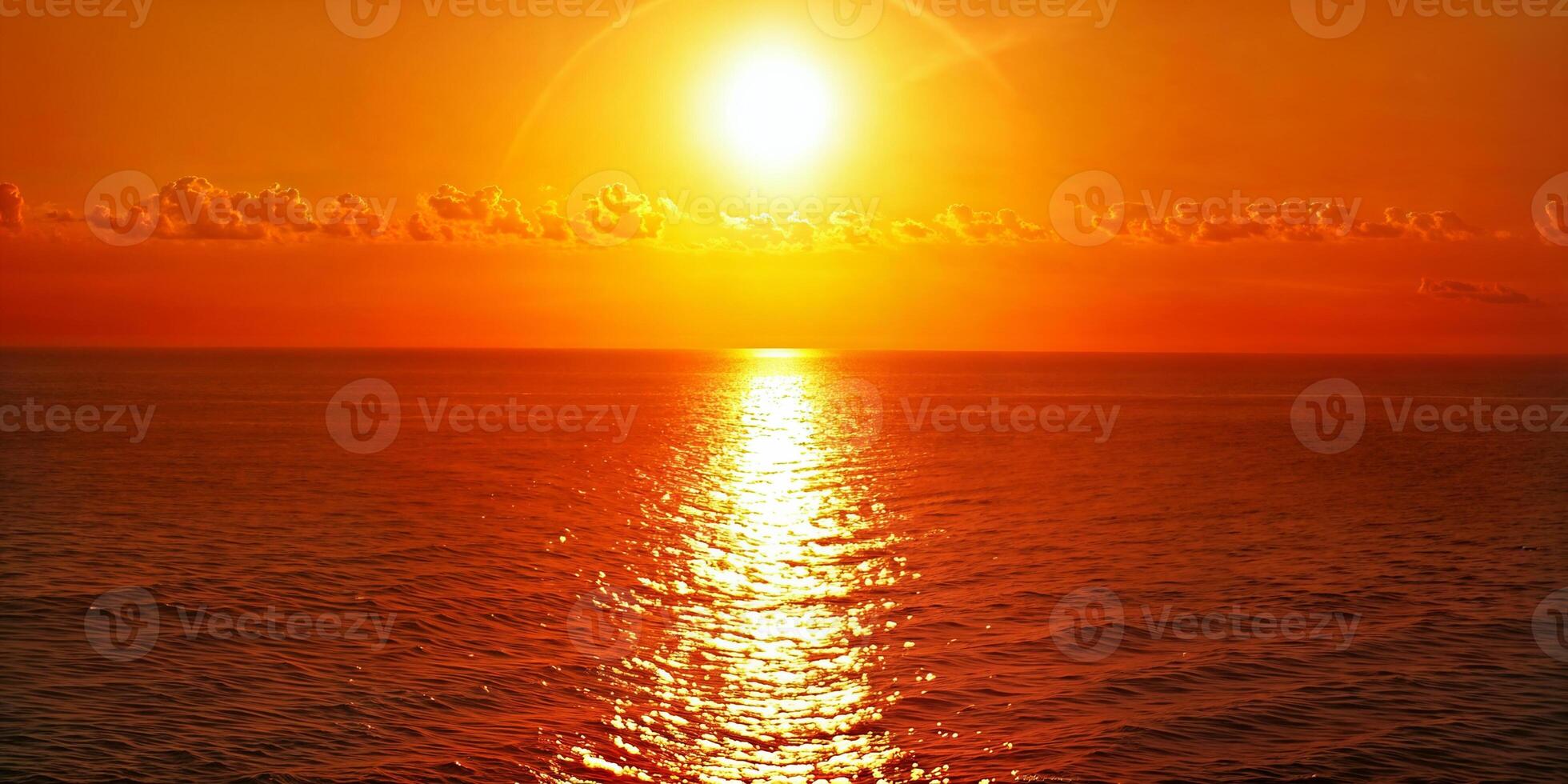 Vibrant sunset over the ocean with golden reflections on calm waters photo