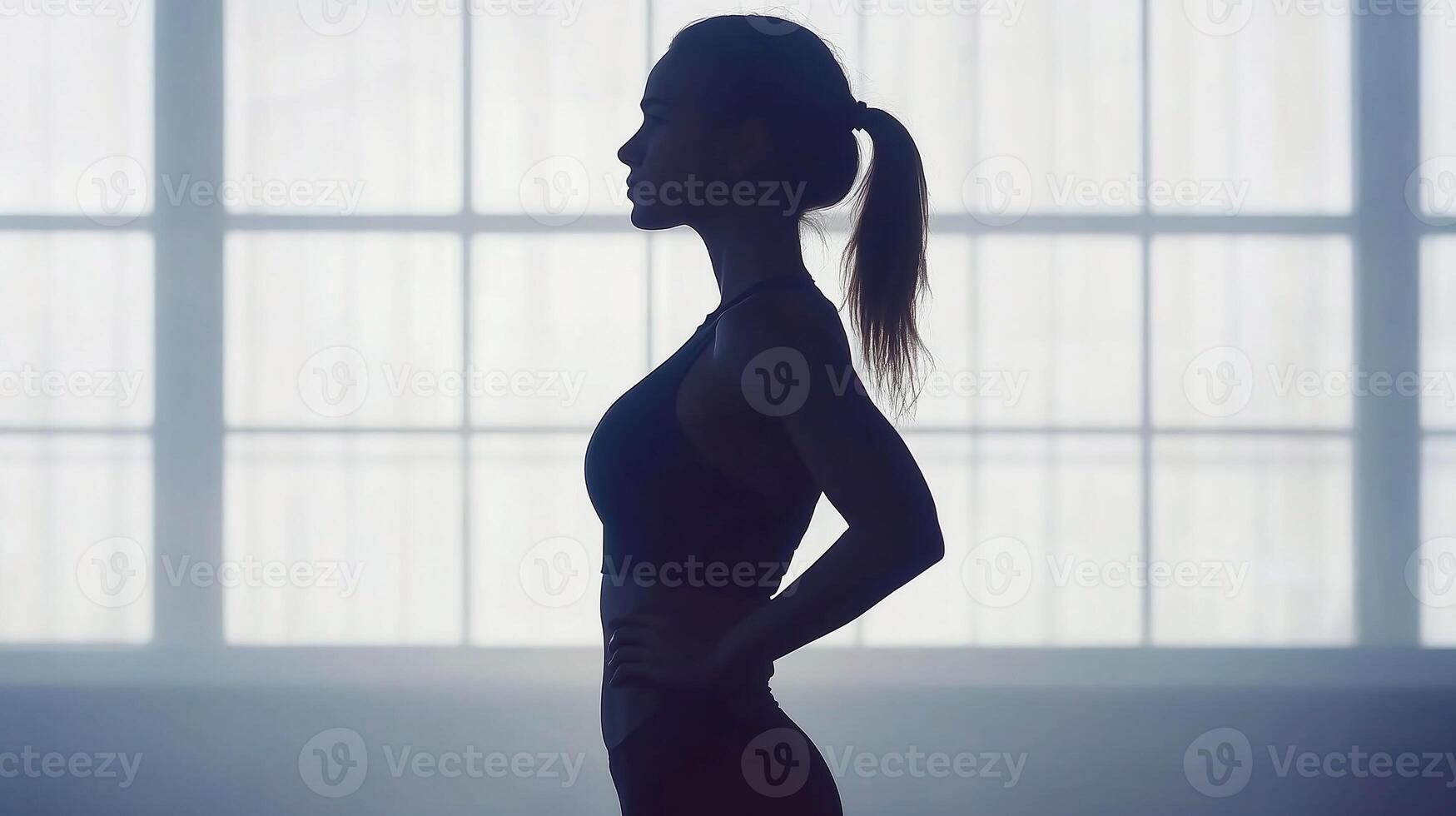 Silhouette of a woman athlete in a training session highlighting a healthy lifestyle photo