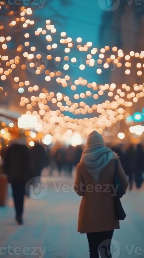 Blurred crowd gathers under festive lights during winter celebrations in a lively city atmosphere photo