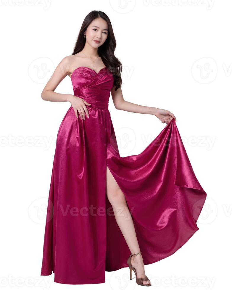 A woman in a floor-length, magenta satin dress with a thigh-high slit, poses confidently. She has long, dark hair. on white background photo