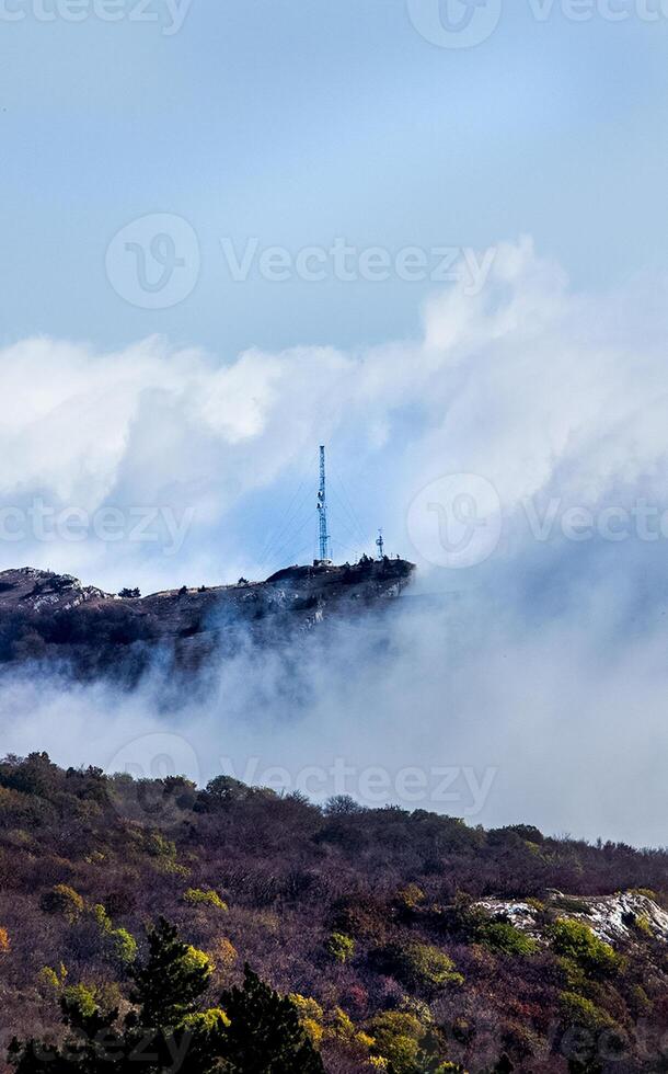 Low clouds over valley, view from the mountains. Low clouds. photo