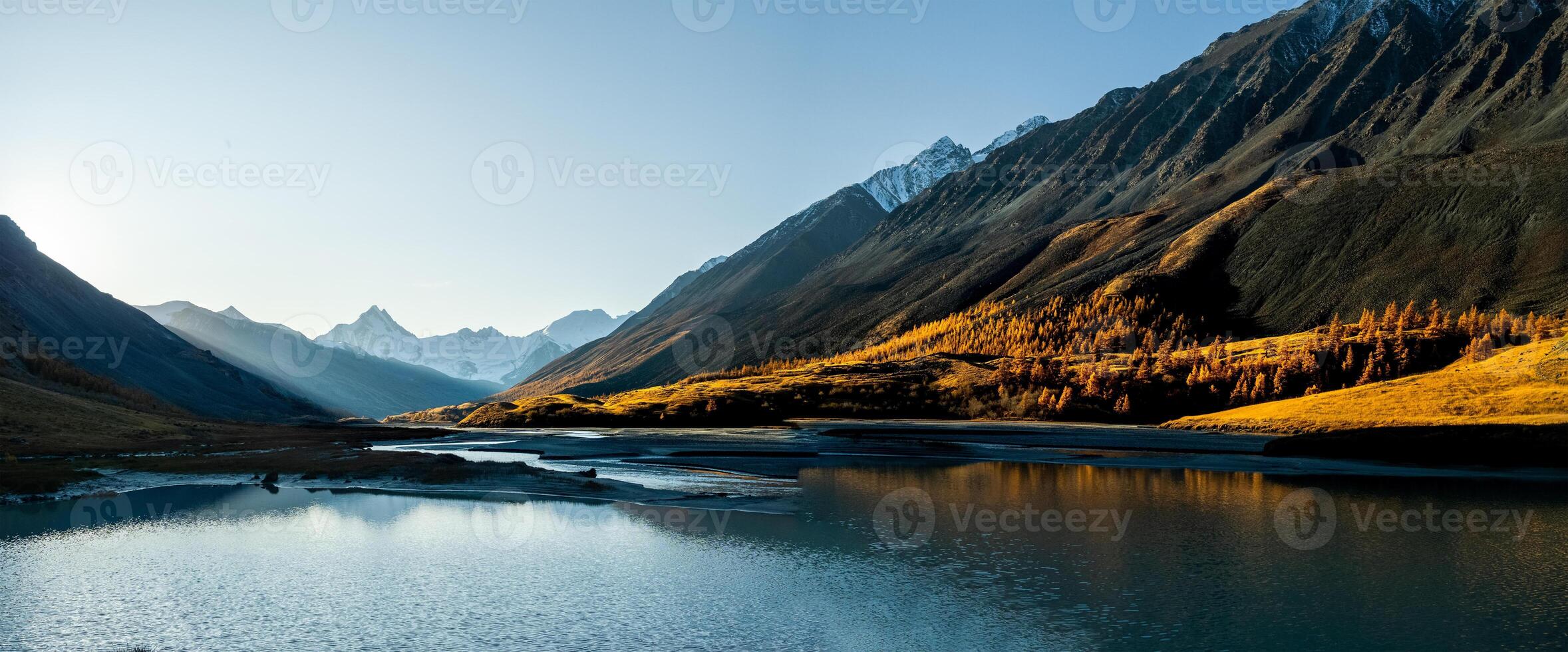 Lake in Altai Mountains. Panorama of the Altai landscape in the mountains. The time of year is autumn. photo