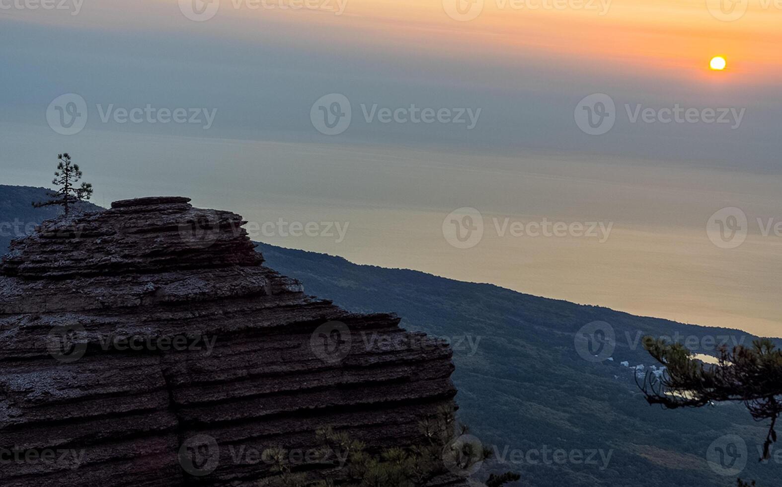 Mountains and forests of Crimea. coniferous and deciduous trees on the hills of mountains and rocks photo