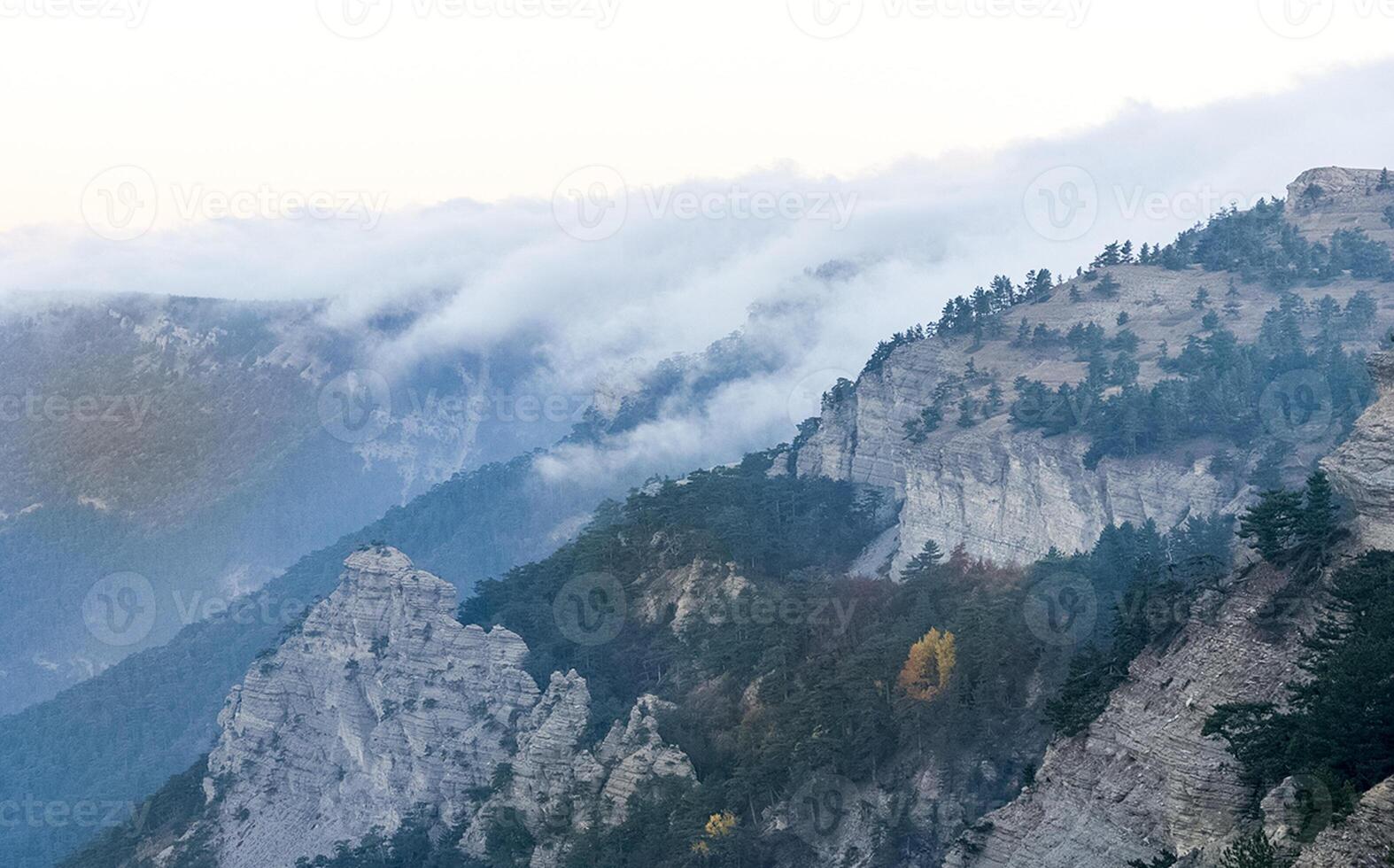 Mountains and forests of Crimea. coniferous and deciduous trees on the hills of mountains and rocks photo
