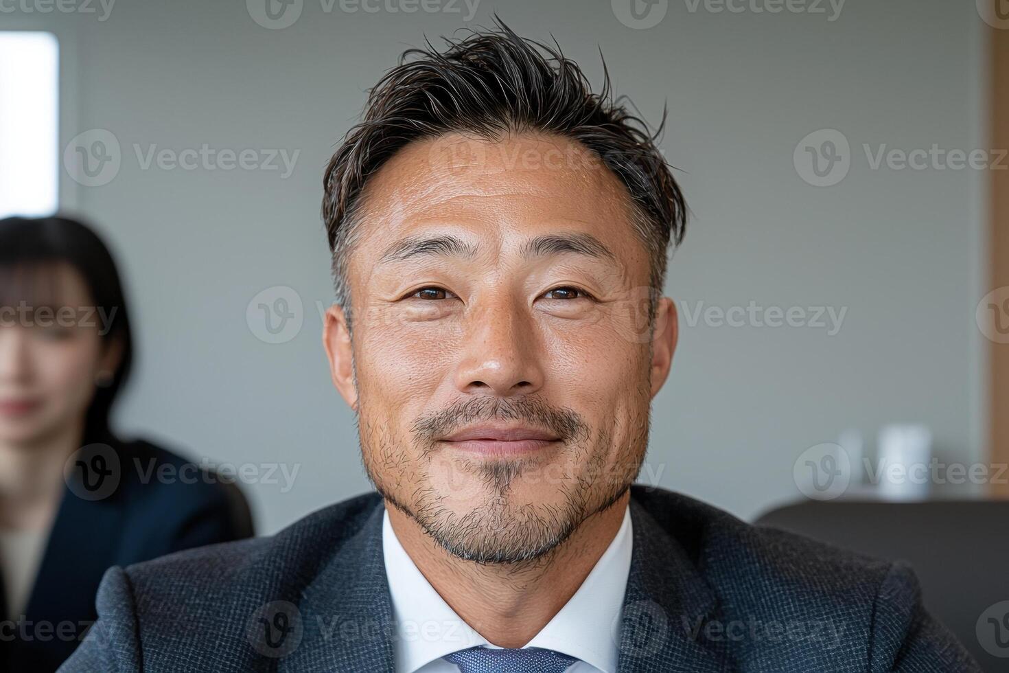 Portrait of a smiling Asian businessman in a suit photo