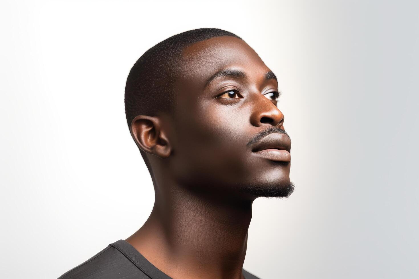 Thoughtful young african man with serious expression photo