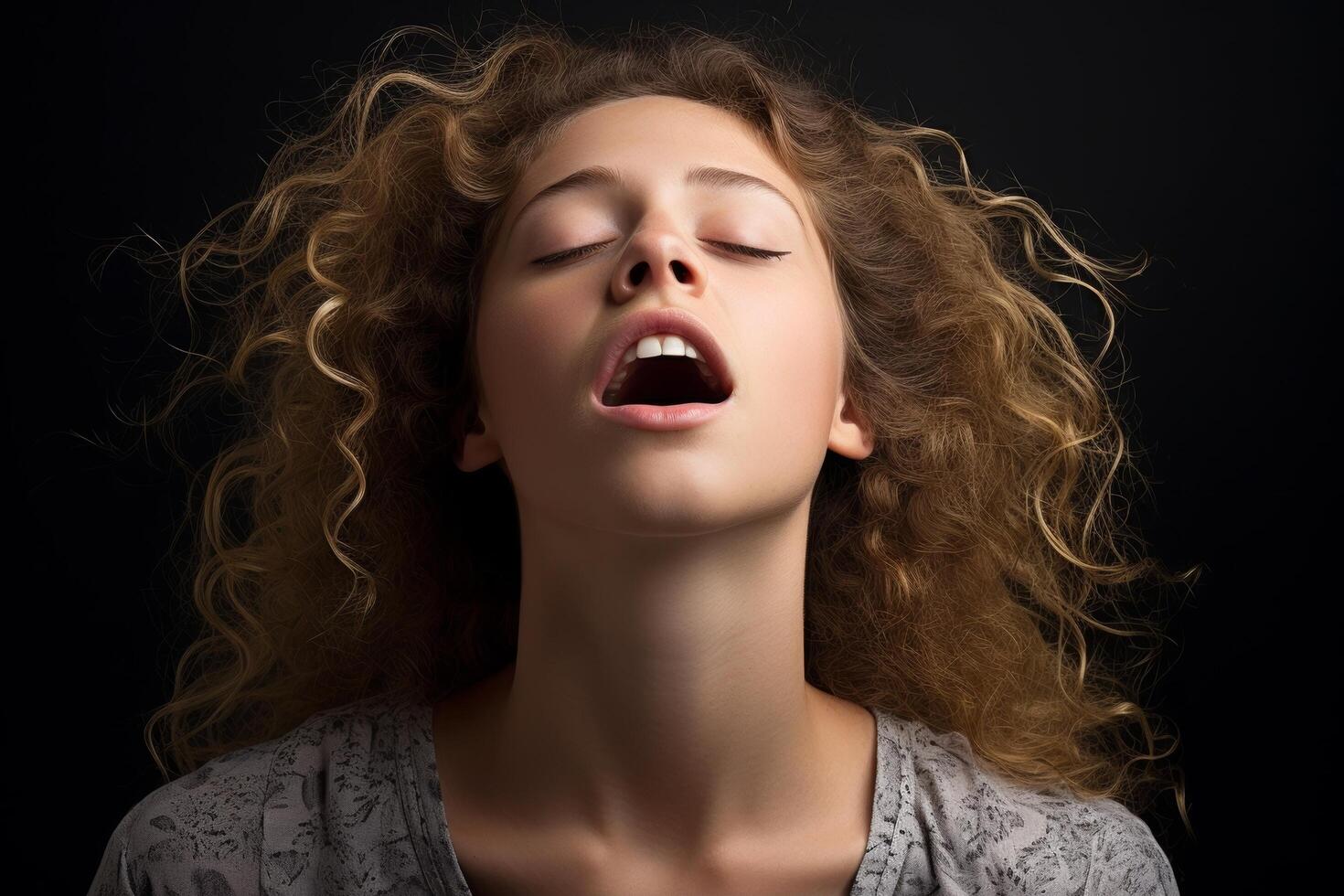 Dramatic portrait of a woman with curly hair photo