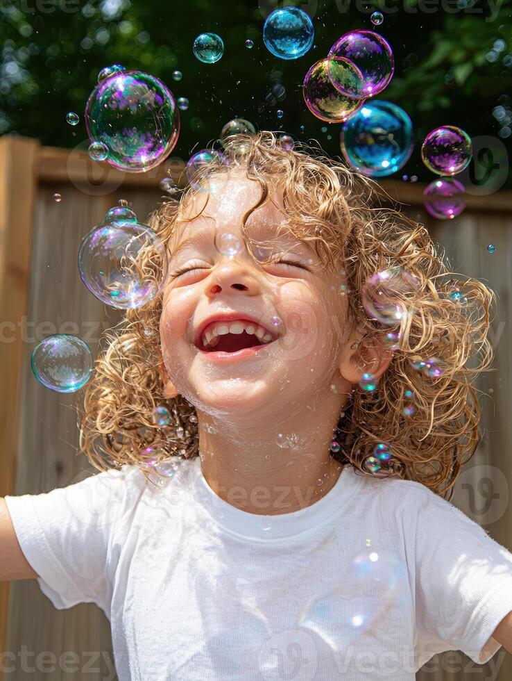 Joyful child playing in bubbles outdoors on a sunny day photo
