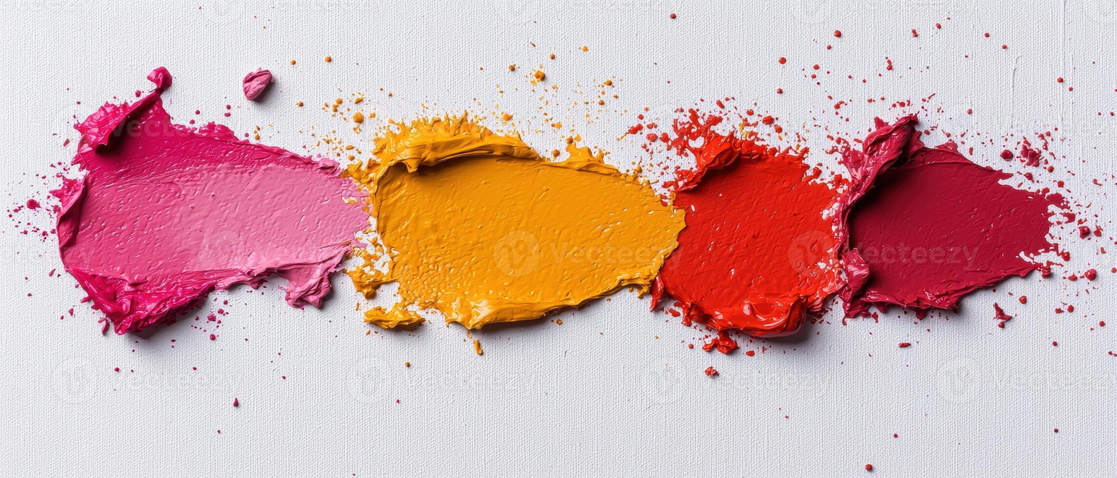 Abstract paint strokes in pink, orange, and red on white canvas photo
