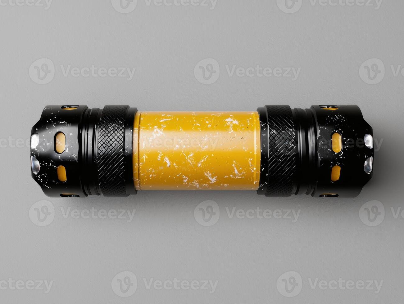 Close up of a yellow and black flashlight with a distressed finish photo