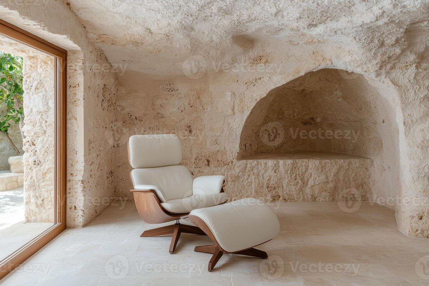 Modern chair and ottoman in a minimalist cave like room photo