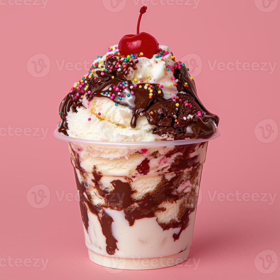 Delicious chocolate sundae with sprinkles and cherry on top photo