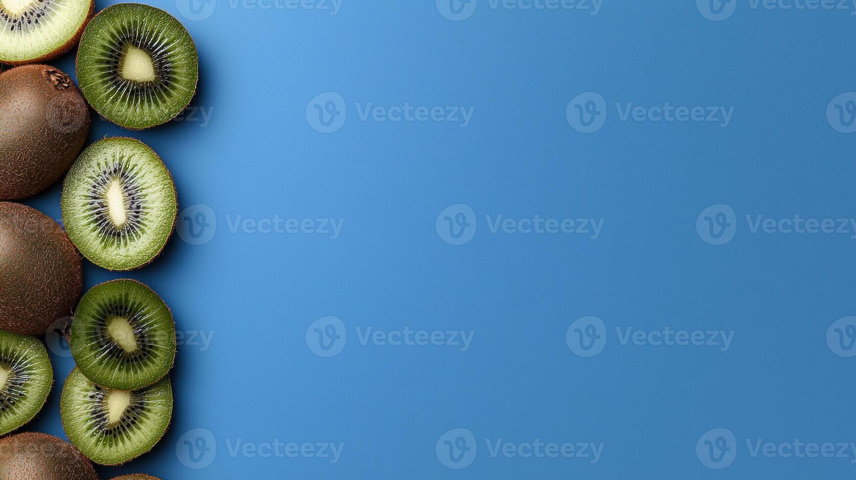 Close up of sliced kiwis on a blue background photo