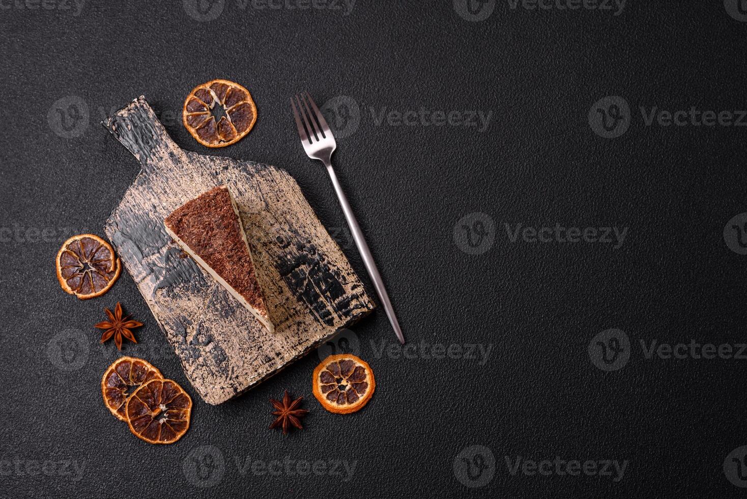 Slice of sweet cheesecake sprinkled with chopped chocolate photo